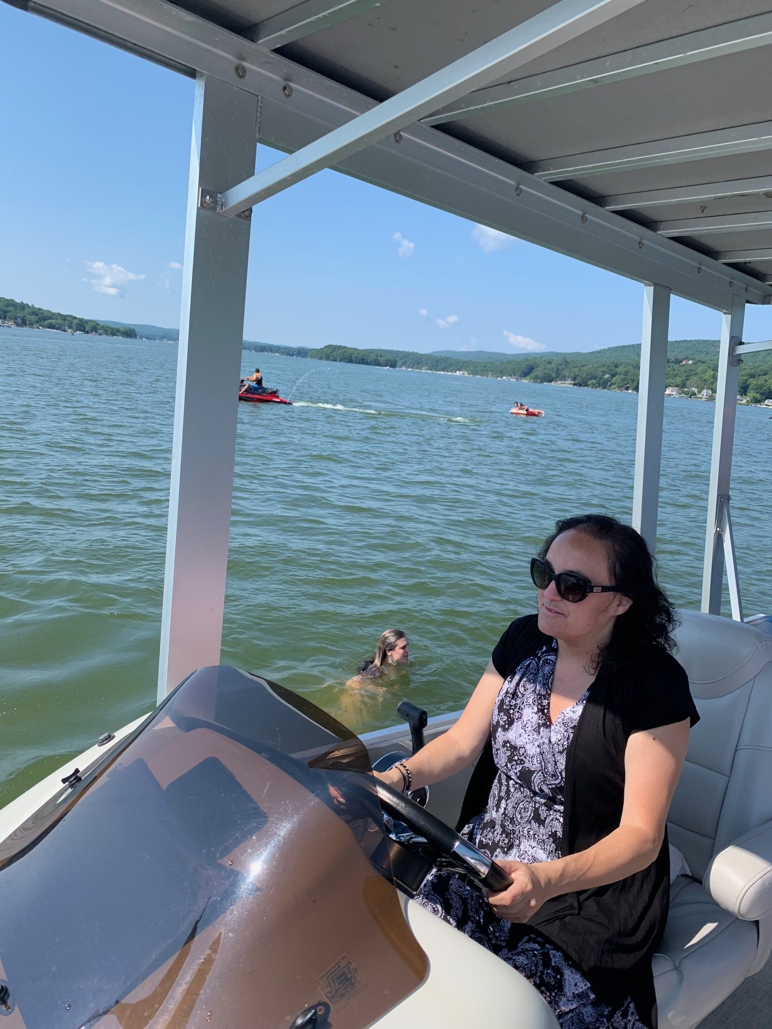 tara-bisciello-driving-boat Tara Bisciello driving a boat.