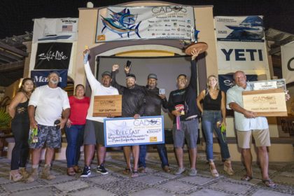 A fishing team celebrates a win.