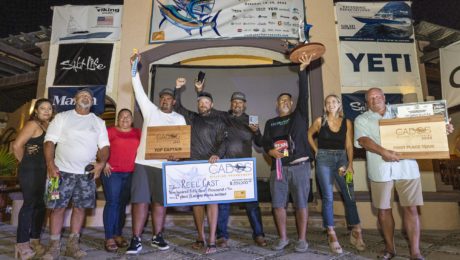 A fishing team celebrates a win.