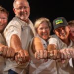 Anglers showing off their championship rings.