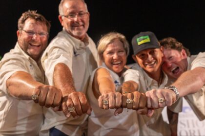 Anglers showing off their championship rings.